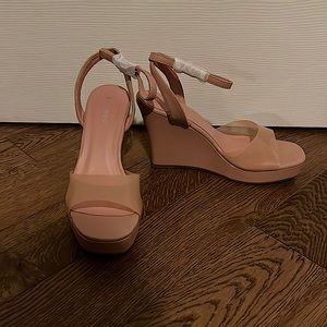 Baby Pink wedged heel. Never been worn. Size 6